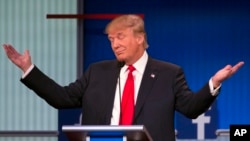Republican presidential candidate Donald Trump gestures during the first Republican presidential debate, Cleveland IN, Aug. 6, 2015.