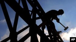 A soldier from the 2nd Engineering Regiment of France's Foreign Legion, works on a bridge being constructed to replace a bridge of Mdeirej, that was damaged during Hezbollah-Israeli conflicton 