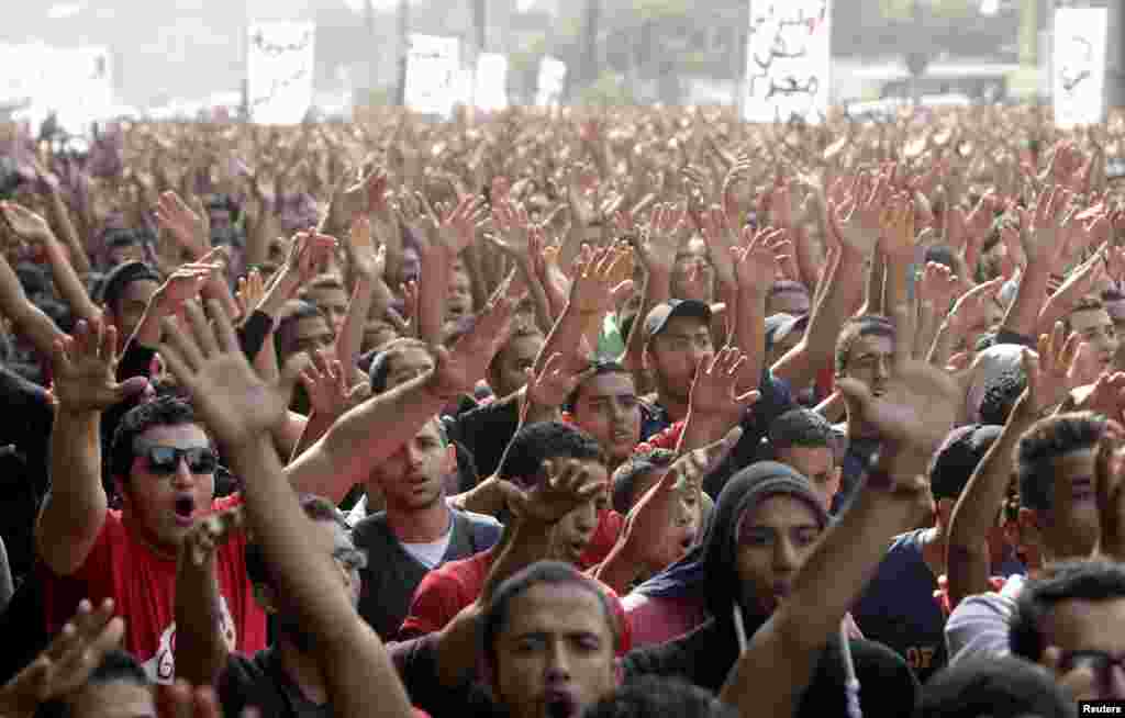 Al Ahli fans take part in a protest march in front of the general prosecutor's office in Cairo. The protesters were calling for the release of their fellow fans, who were arrested earlier last month during clashes with security personnel as the club's handball team returned from Morocco after winning silver in the African Champions League handball tournament.