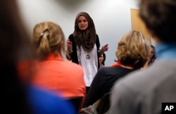 Syrian-American poet Amal Kassir recites her work during a gathering where immigrants from hostile environments spoke about their lives, at the YWCA in Boulder, Colorado, April 19, 2016.