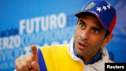Miranda's state governor and opposition leader Henrique Capriles speaks during an interview with Reuters in Caracas February 26, 2014. One month ago, Capriles was Venezuela's undisputed opposition leader, espousing a vision of dialogue and measured dissen