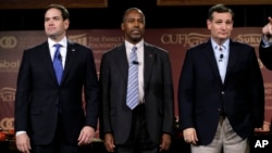 FILE - Republican presidential candidates (L-R) Senator Marco Rubio, retired neurosurgeon Ben Carson and Senator Ted Cruz stand on stage during the Presidential Family Forum, Nov. 20, 2015, in Des Moines, Iowa.