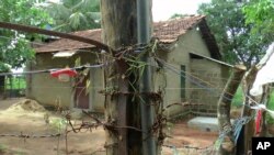 Illegally erected electric fence and traps set up to prevent wild elephants from entering human settlements are seen in Ashraf Nagar in Ampara district, about 210 kilometers (130 miles) east of the capital Colombo, Tuesday, Jan. 11, 2022. (AP Photo/Achala