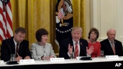 President Donald Trump, center, meets with Republican senators on health care in the White House, June 27, 2017. Seated with him, from left, are Sen. Susan Collins, R-Maine and Sen. Lisa Murkowski, R-Alaska.