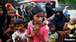 New Rohingya refugees arrive near the Kutupalang makeshift Refugee Camp, in Cox’s Bazar, Bangladesh, Aug. 29, 2017. 