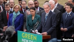 U.S. Representative Alexandria Ocasio-Cortez (D-NY) and Senator Ed Markey (D-MA) hold a news conference for their proposed "Green New Deal" to achieve net-zero greenhouse gas emissions in 10 years, at the U.S. Capitol in Washington, Feb. 7, 2019.