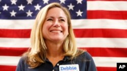 Florida Democratic congressional candidate Debbie Mucarsel-Powell smiles before speaking to volunteers at a get out the vote event with fellow congressional candidate Donna Shalala, and House Minority Leader Nancy Pelosi, Oct. 17, 2018, in Coral Gables, Fla.