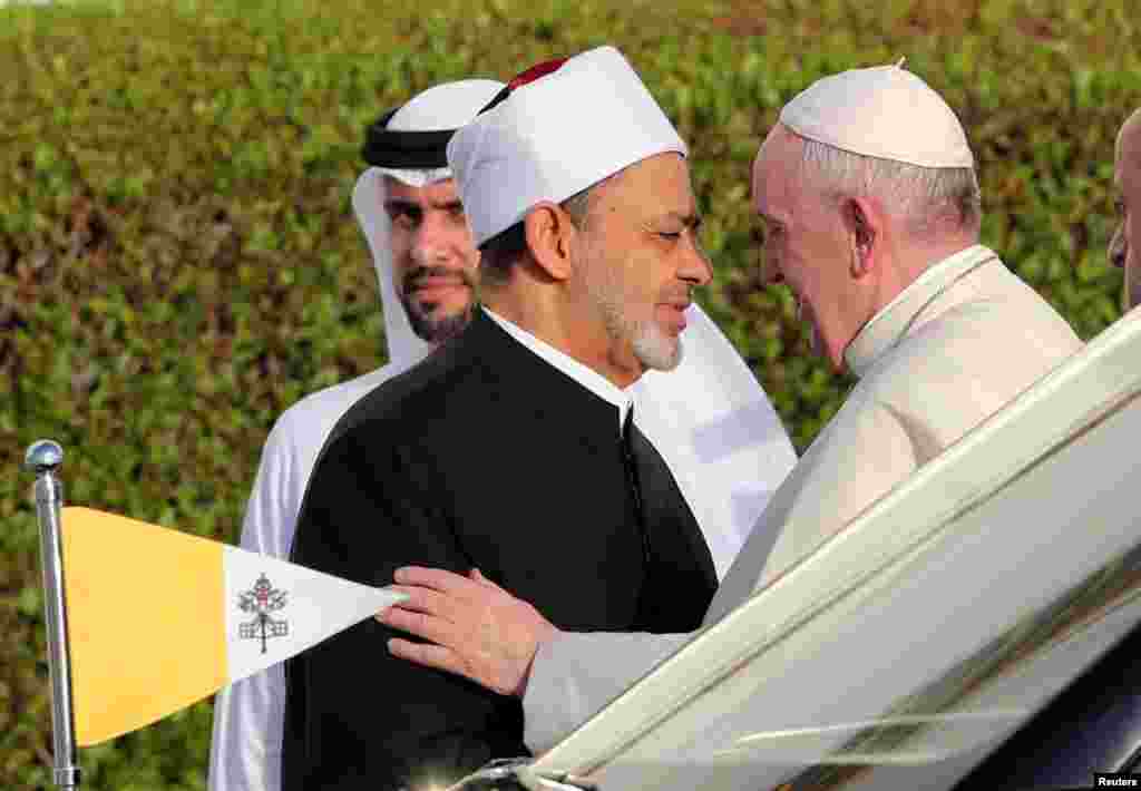 Pope Francis is welcomed by Grand Imam of al-Azhar Sheikh Ahmed al-Tayeb at the sheikh Zayed grand Mosque in Abu Dhabi, United Arab Emirates.