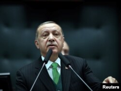 Turkey's President Tayyip Erdogan addresses members of parliament from his ruling AK Party during a meeting at the Turkish parliament in Ankara, Turkey, January 16, 2018.