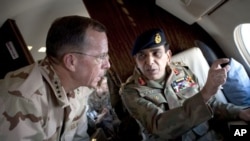 Gen. Ashfaq Parvez Kayani, Pakistani chief of Army Staff points out a feature to US Admirtal Mike Mullen, chairman of the Joint Chiefs of Staff, during an aerial tour of Pakistan, 24 Jul 2010