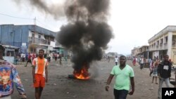 FILE - Congolese protest against President Joseph Kabila's refusal to step down from power in Kinshasa, Democratic Republic of Congo, Dec. 31, 2017. Four activists were sentenced to a year in prison Tuesday for inciting protests against Kabila.