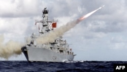 In this handout picture retrieved on Feb. 10, 2016 from the British Ministry of Defense via Defense News Imagery the British Royal Navy Type 23 frigate, HMS Iron Duke, is pictured at sea firing her Harpoon anti-ship missile system.