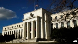 FILE - The Federal Reserve building 