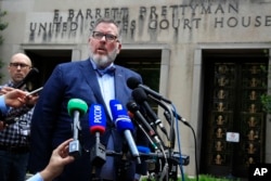 Robert Driscoll, Maria Butina's attorney, speaks to reporters outside the federal court in Washington, April 26, 2019, following the sentencing of his client. Butina, a Russian gun rights activist, was sentenced to 18 months in prison on Friday after admitting she secretly worked for the Kremlin to infiltrate conservative U.S. political groups.