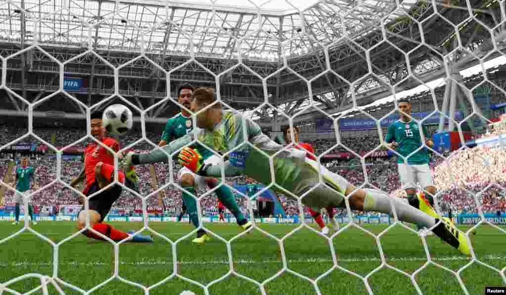 Germany&#39;s Manuel Neuer punches the ball away from South Korea&#39;s Son Heung-min during the Group F match&nbsp;between South Korea and Germany at the 2018 soccer World Cup in the Kazan Arena in Kazan, Russia.