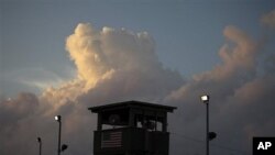 Photo reviewed by the U.S. military shows a guard looking out from a tower in front of the detention facility on Guantanamo Bay U.S. Naval Base in Cuba. (file)