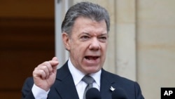 FILE - Colombia's President Juan Manuel Santos speaks to the media in Bogota, Colombia, April 17, 2015. 