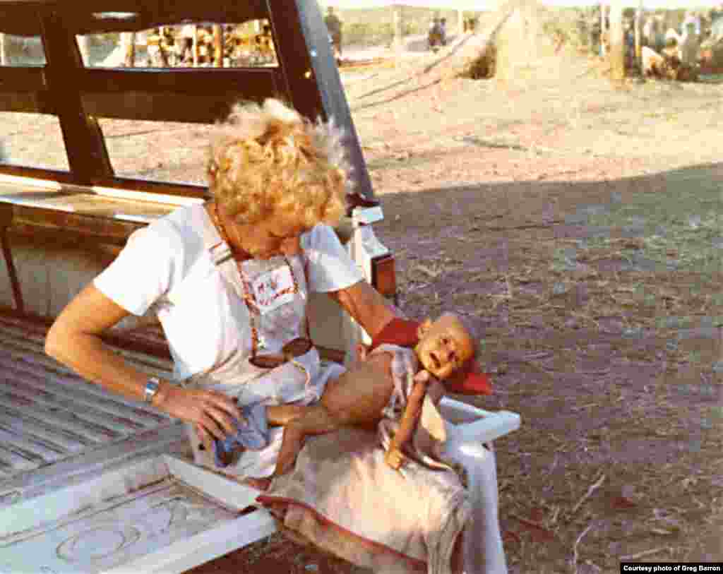 An aid worker with a starving child in Nong Samet refugee camp in Thailand, in November, 1979.