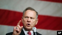 FILE - Former Alabama Chief Justice and U.S. Senate candidate Roy Moore speaks at a campaign rally, Dec. 5, 2017, in Fairhope Ala.