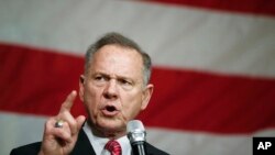 FILE - Former Alabama Chief Justice and U.S. Senate candidate Roy Moore speaks at a campaign rally, Dec. 5, 2017, in Fairhope Ala.