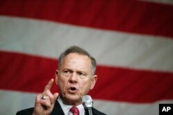 FILE - Former Alabama Chief Justice and U.S. Senate candidate Roy Moore speaks at a campaign rally, Dec. 5, 2017, in Fairhope, Ala.