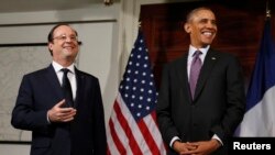 Prezida wa Amerika, Barack Obama na prezida w'Ubufransa, Francois Hollande mu rugendo rwiwe i Washington DC