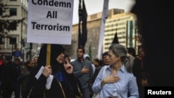 FILE - American Shi'ite Muslims march to the White House to protest against the Islamic State group, in Washington, D.C., Dec. 6, 2015. 