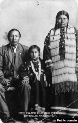 Black Elk, daughter Lucy Black Elk, and second wife Anna Brings White in their home in Manderson, South Dakota, about 1910.