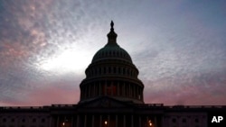 The U.S. Capitol is seen at sunset, Jan. 5, 2022, in Washington. Thursday marks the first anniversary of the Capitol insurrection, a violent attack that has fundamentally changed Congress and prompted widespread concerns about the future of American democracy.