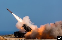 FILE - A Patriot weapons system is fired at the NATO Missile Firing Installation in Chania, Greece.