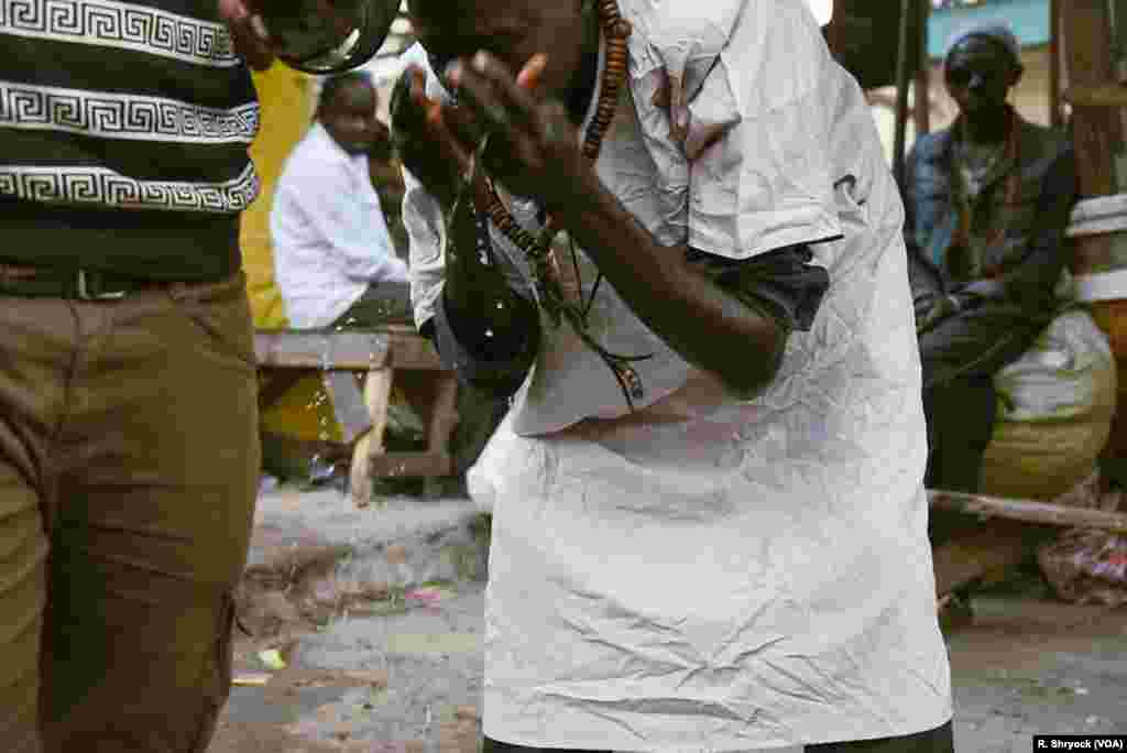 A man washes up for prayers just before the sun sets Mar 24, 2018, during Ramadan in Dakar, Senegal.