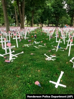 A Memorial Day display of crosses is destroyed after a vehicle drove through them in Henderson, Kentucky's Central Park, May 28, 2016. The display honors the names of more than 5,000 from the city and county of Henderson who served in conflicts dating back to the Revolution.
