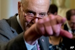 Senate Minority Leader Sen. Chuck Schumer of N.Y. calls on a reporter following a closed-door Democratic policy meeting, at the Capitol in Washington, Sept. 25, 2018.