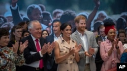 Britain's Prince Harry and the Duchess of Sussex attend the launch of the Nelson Mandela Centenary Exhibition, marking the 100th anniversary of anti-apartheid leader's birth, at the Queen Elizabeth Hall in London, July 17, 2018.