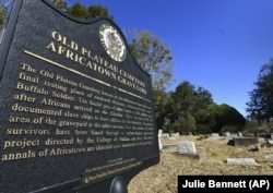 Old Plateau Cemetery, the final resting place for many who spent their lives in Africatown, stands in need of upkeep near Mobile, Ala. Many of the survivors of the slave ship Clotilda's voyage are buried here among the trees.
