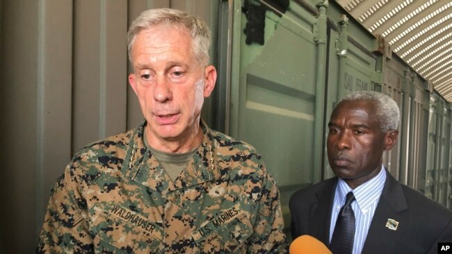 Gen. Thomas D. Waldhauser, left, commander of U.S. Africa Command, is joined by U.S. Ambassador to Senegal Tulinabo S. Mushingi, right, after a tour of Camp Cisse where the U.S. maintains a small site in Dakar, Senegal, July 30, 2018. 