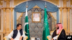 FILE - Pakistani Prime Minister Imran Khan, left, meets Saudi Crown Prince Mohammed bin Salman, Sept. 19, 2018, in Jiddah, Saudi Arabia. 