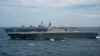 美国航母打击群与日本直升机航母在南中国海进行联合演习