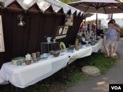 Crafts on display included beadwork, glassware, prints, dolls and pottery.