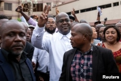 Felix Tshisekedi, leader main DRC opposition party, the Union for Democracy and Social Progress (UDPS) who has been declared the winner of the presidential elections, gestures to his supporters in Kinshasa, Jan. 10, 2019.