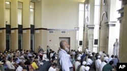 Worshipers listen to the sermon in the main hall of the Noor Islamic Center in Dublin, Ohio, Aug. 26, 201.