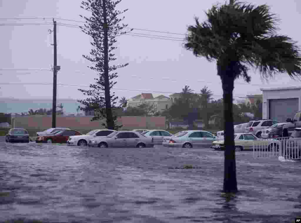 Vehicles are surrounded by water after Hurricane Irma passed through Naples, Florida, Sept. 10, 2017.