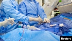 Heart Disease - Surgeons perform a non-emergency angioplasty at Mount Sinai Hospital in New York. Through a blood vessel in the groin, a tube is guided to a blockage in the heart. 