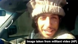 This undated image taken from a Militant Website shows Belgian Abdelhamid Abaaoud. A French official said Abaaoud is the suspected mastermind of the Paris attacks was also linked to thwarted train and church attacks. 