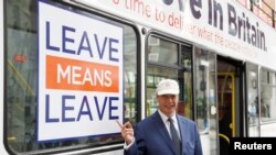 Nigel Farage poses for pictures as he launches Leave Means Leave's campaign against Britain's Prime Minister Theresa May's Chequers Brexit plan, in central London, Sept. 20, 2018. The European Union has also rejected May's plan.