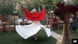 Fahima Mirzaie performs a Sema dance (Sufi Whirling) in Kabul Afghanistan, Thursday, Aug. 20, 2020. (AP Photo/Mariam Zuhaib)