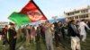 FILE - Afghan cricket fans celebrate the victory of the national cricket team over Zimbabwe as the team returns and celebrates in Kabul, Afghanistan, Oct. 30, 2015.