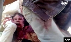 Kaddafi'nin amatör videoya çekilen cesedinin görüntüsü
