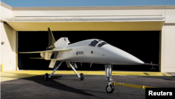Boom Supersonic’s demonstrator aircraft XB-1 is seen parked at a hangar in Denver, Colorado in an undated photograph released on October 7, 2020. (Boom Supersonic/Nathan Leach-Proffer/Handout via Reuters)