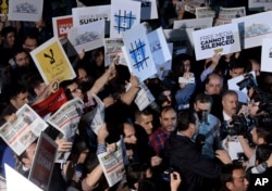 FILE - People rally in support of press freedom in Istanbul, Turkey, Oct. 9, 2015.